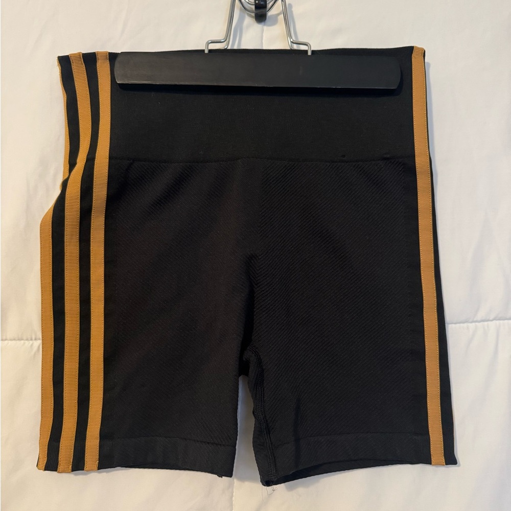 IVY PARK Black and Gold Bike Shorts Athletic Style